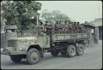 Armed soldiers on a military truck