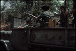 Armed soldiers on a military truck