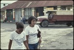 [1978] Two women walking in front of Home Industries Co-op Ltd. Modern furniture dealers