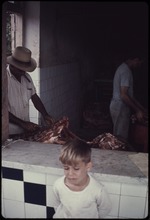 A man butchering meat