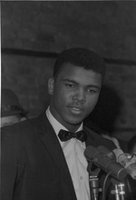 Cassius Clay performing a poetry reading at the Bitter End Club