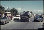 A truck carrying police in the bed during the 1990 Haitian general election