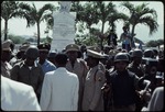 Prosper Avril and a group of Haitian military officers standing in front of a statue
