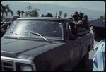 [1990] A truck carrying police in the bed during the 1990 Haitian general election