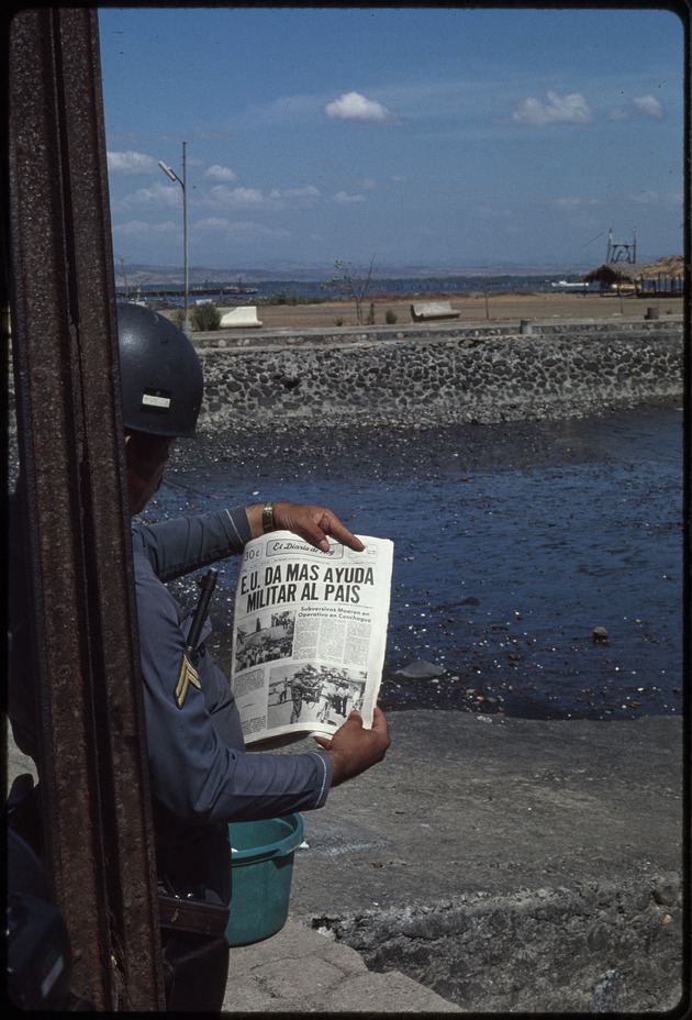 Military officer reading the newspaper, El Diario de Hoy, San Salvador, El Salvador