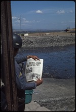 Military officer reading the newspaper, El Diario de Hoy, San Salvador, El Salvador