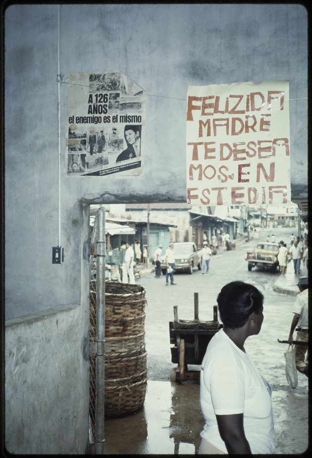 Political posters on the walls of a market