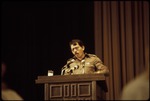 Daniel Ortega, standing at a podium at the Non-Aligned Movement Conference
