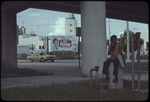 Miami street scene with billboard Elect Luis C. Morse