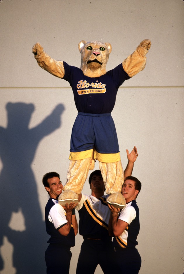FIU cheerleader lift with the Panther mascot