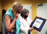 Miami Dade County Mayor Daniella Levine Cava presents Distinguished Visitor plaque to Bea Brickell