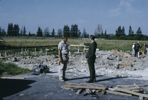 B. G. Olson talking to the construction supervisor at Tamiami Campus