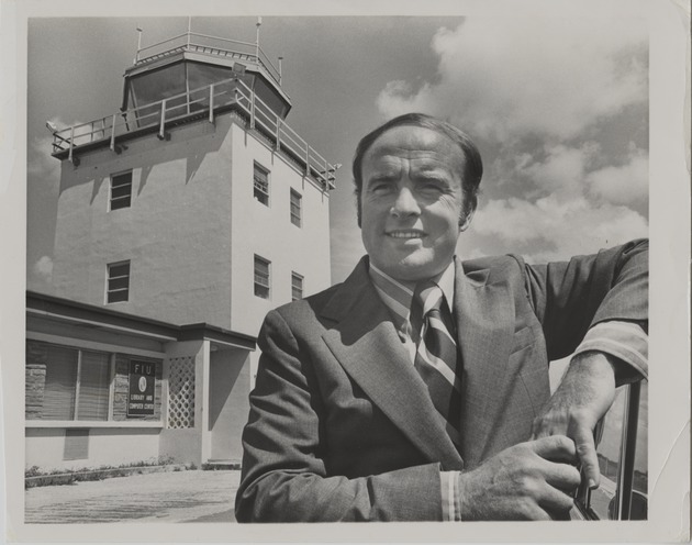 Charles E. Perry pictured in front of the Florida International University Library and Computer Center - Recto