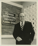 [1970] Charles Perry standing in front of the Florida International University Planning Offices