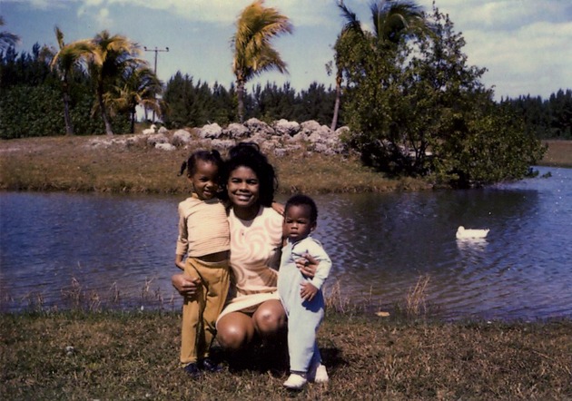 Woman and two children by water