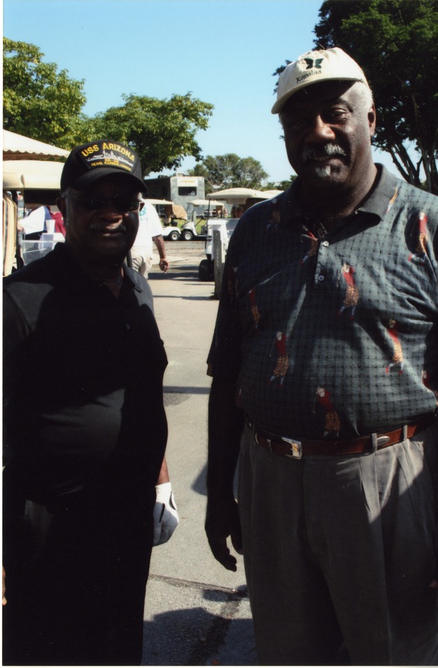 Two men at golf tournament