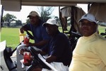 Three men in golf cart