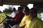 Four men in golf cart