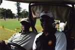 Two men on golf cart
