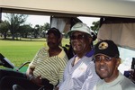 Three men on golf cart
