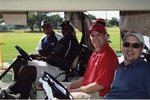 Four men on golf cart