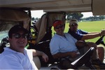 [2007-12-12] Three men pose in golf carts