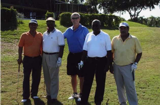 Group of five men poses