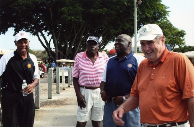 Four men laughing