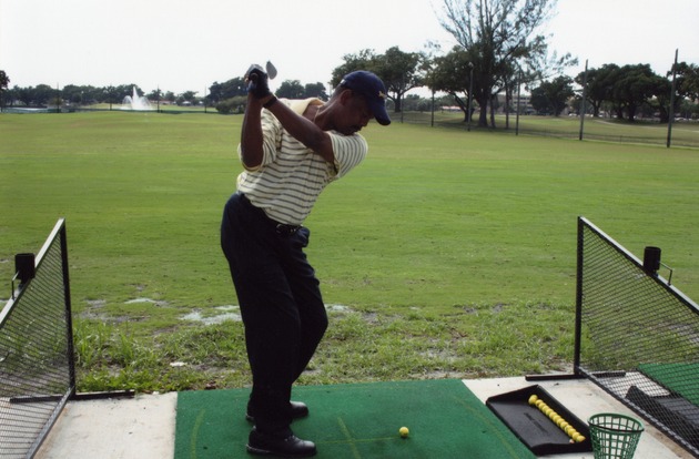 Golfer in mid-swing