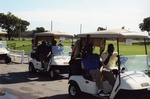 Men driving golf carts