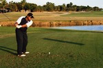 Golfer by lake