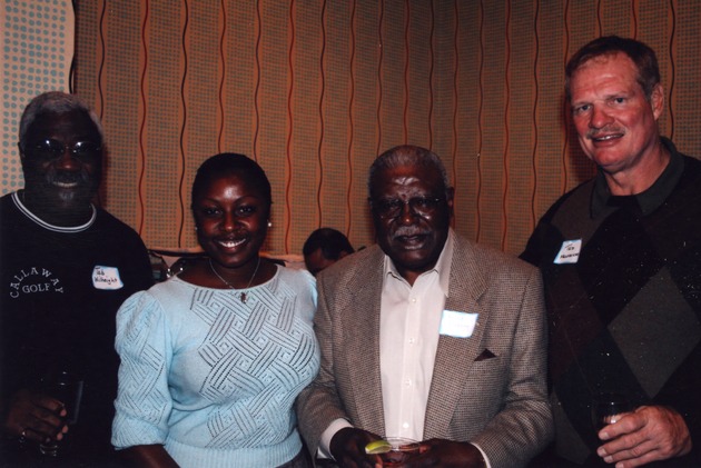 Ted Hendricks posing with guests