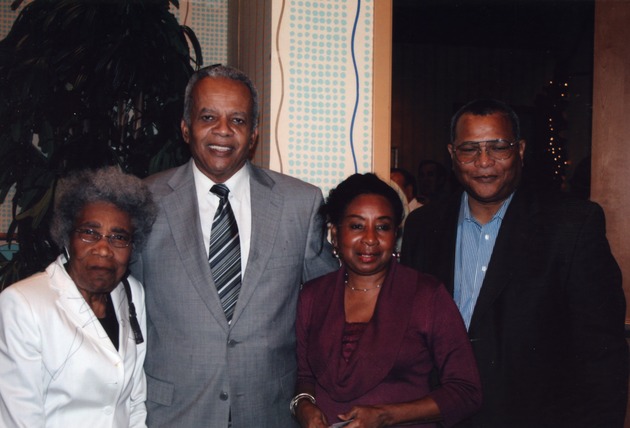 Four guests pose for group shot