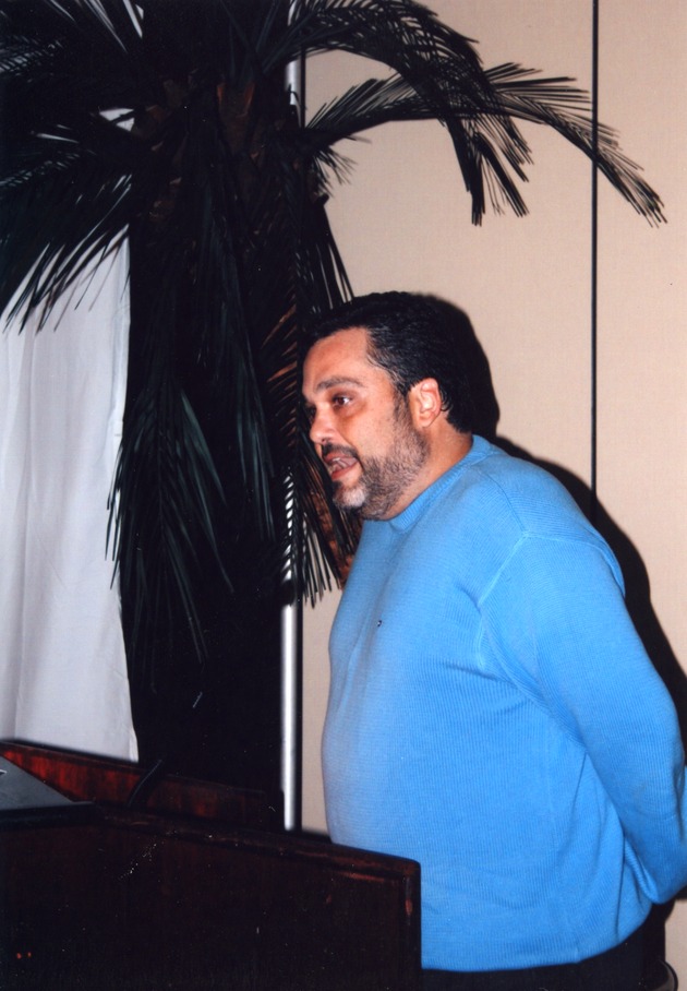 Man addressing guests at reception