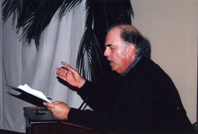 Man reading at podium