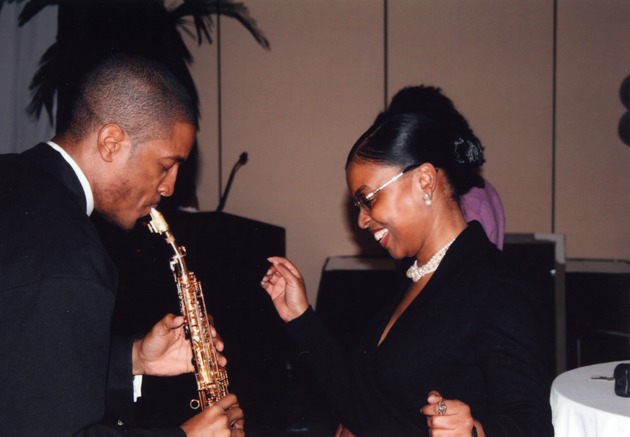 Woman dancing to saxophone music