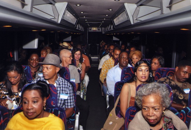 Group of people sit in bus