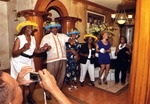 Several people in hats dancing