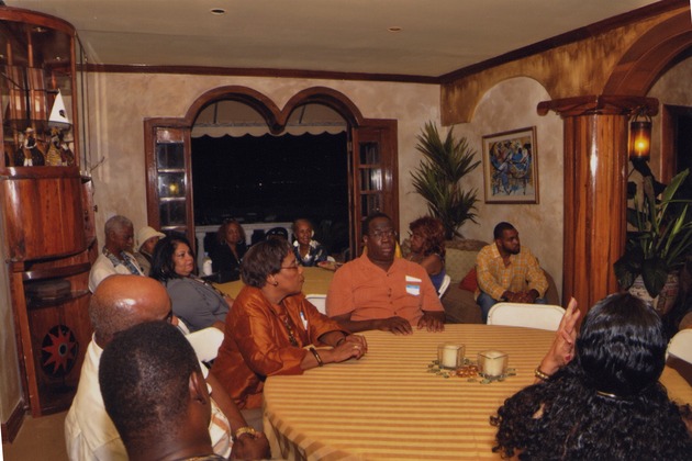 Men and women sit around tables