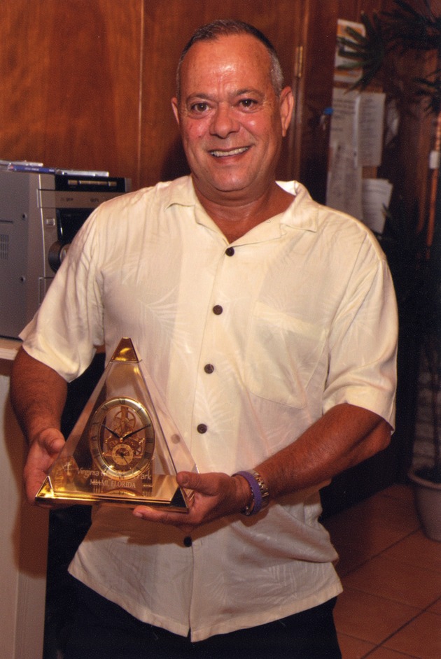 Man holding award
