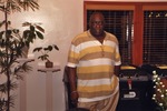 Larry Little poses at dinner party