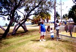 Child and adult visitors in park
