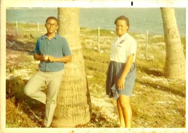 Young man and woman pose on Virginia Key Beach