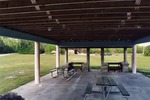 Old picnic tables under shelter