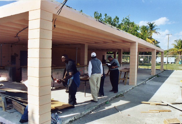 Workers renovating the old concession stand