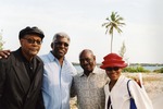 Four people posing on Virginia Key Beach