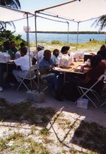 [2004] People sitting at tables eating lunch