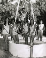 Contestants of the Ms. Universe competition gathered around a water pool at Crandon Park Zoo