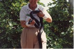 Eastern indigo snake being presented at Miami Metrozoo by a zookeeper