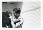 [1967-03] Chimpanzee being held by Crandon Park Zoo Staff